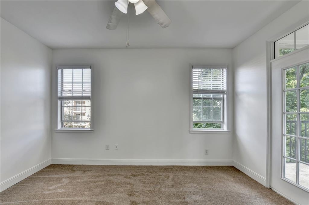 2202 Stratford Commons Decatur, GA 30033 - Photo 22 of 38 an empty room with windows