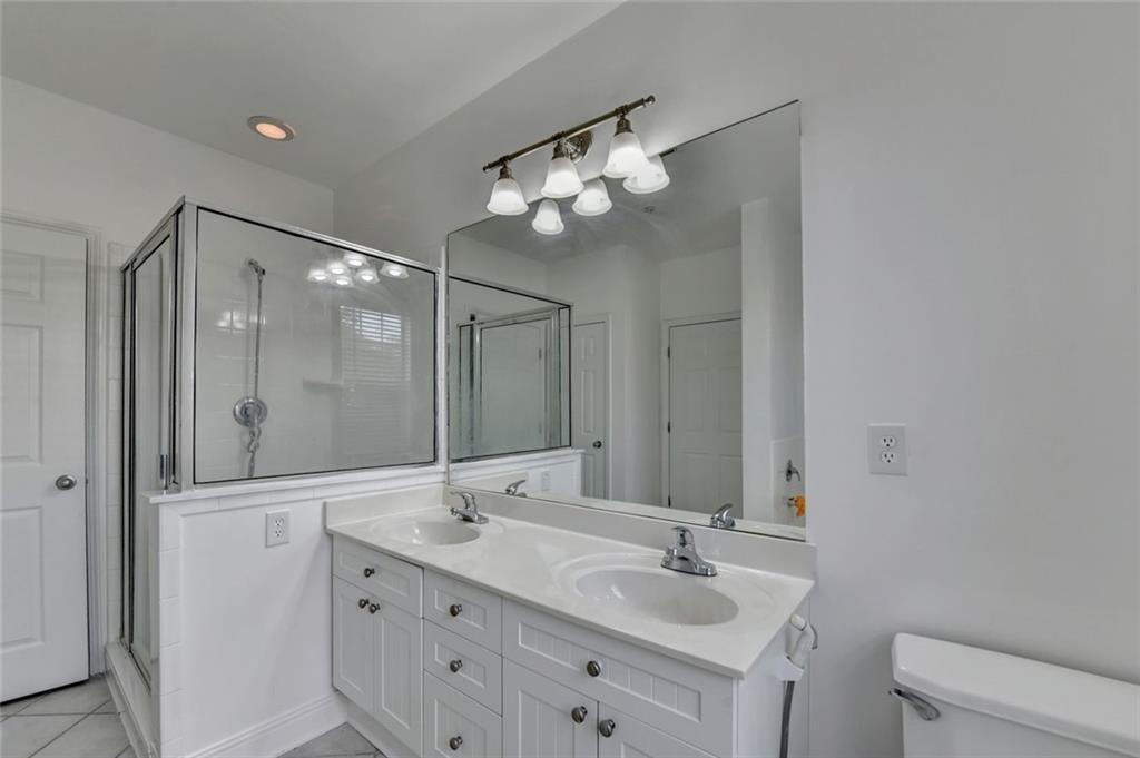 2202 Stratford Commons Decatur, GA 30033 - Photo 25 of 38 a bathroom with a double vanity sink mirror and toilet