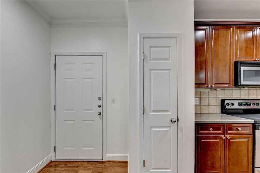 2202 Stratford Commons Decatur, GA 30033 - Photo 3 of 38 a view of a kitchen with wooden floor and cabinets