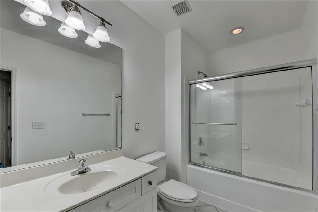 2202 Stratford Commons Decatur, GA 30033 - Photo 33 of 38 a bathroom with a sink toilet a mirror and shower