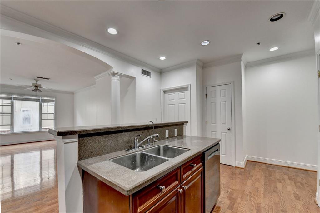 2202 Stratford Commons Decatur, GA 30033 - Photo 7 of 38 a kitchen with granite countertop a sink and a stove
