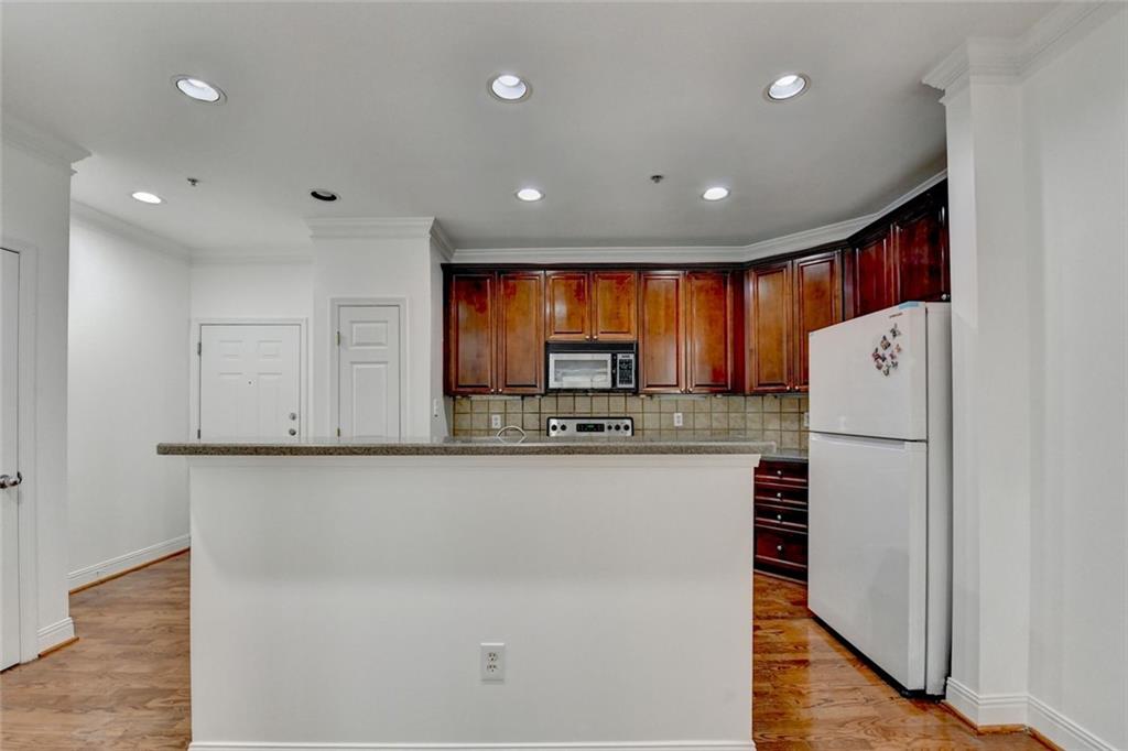 2202 Stratford Commons Decatur, GA 30033 - Photo 9 of 38 a kitchen with stainless steel appliances a refrigerator sink and microwave