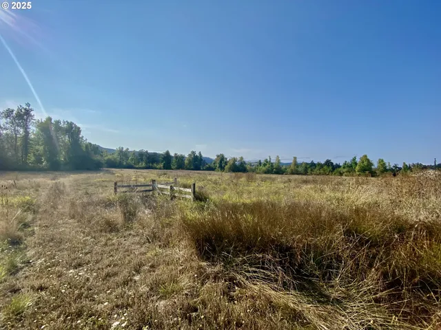 a view of a lake with houses in the back