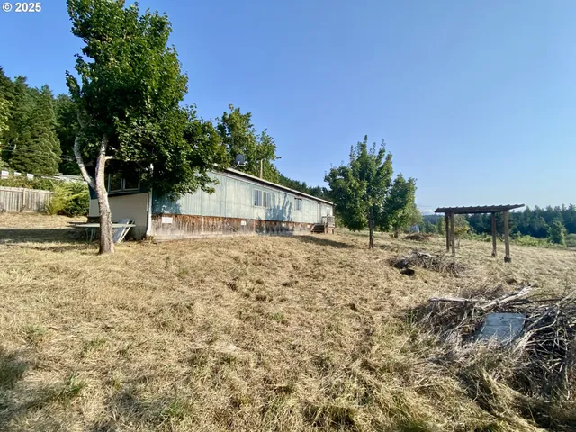 a house with trees in the background