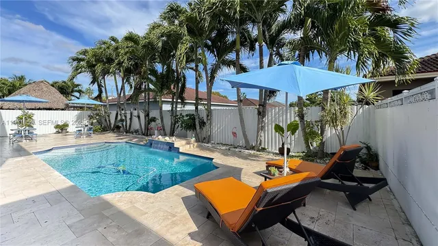 swimming pool with outdoor seating