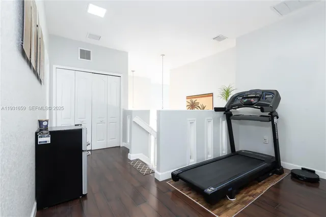 an empty room with wooden floor