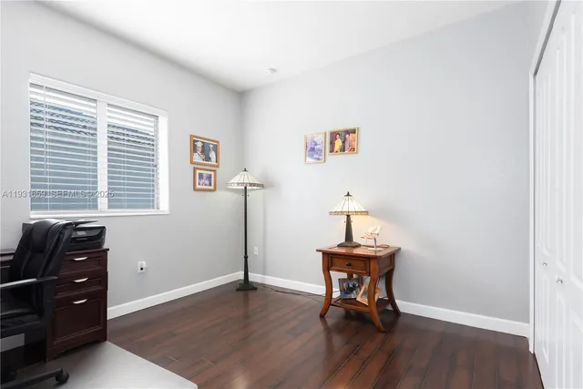 a room with a window and wooden floor