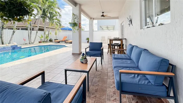 a view of a living room and kitchen