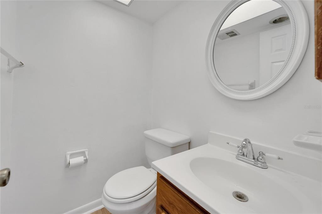 4600 Marine Parkway, Unit 104 New Port Richey, FL 34652 - Photo 33 of 69 a bathroom with a sink a mirror and a toilet