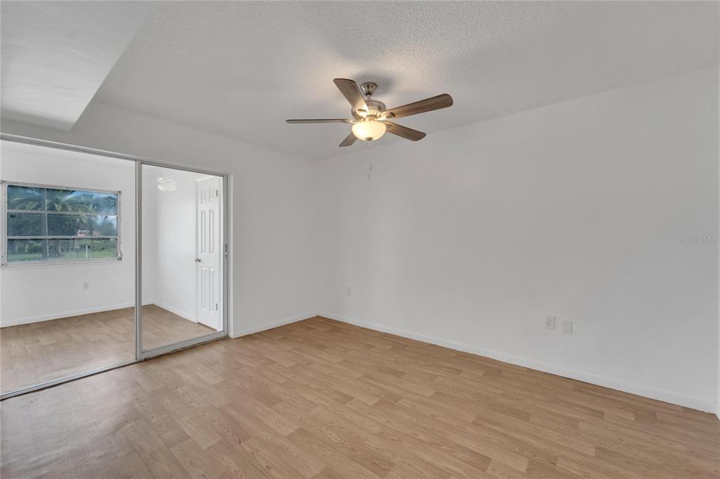 4600 Marine Parkway, Unit 104 New Port Richey, FL 34652 - Photo 34 of 69 wooden floor in an empty room with a window