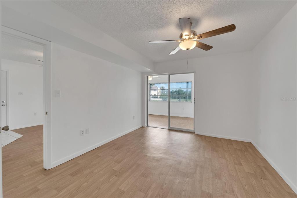 4600 Marine Parkway, Unit 104 New Port Richey, FL 34652 - Photo 35 of 69 wooden floor in an empty room with a window