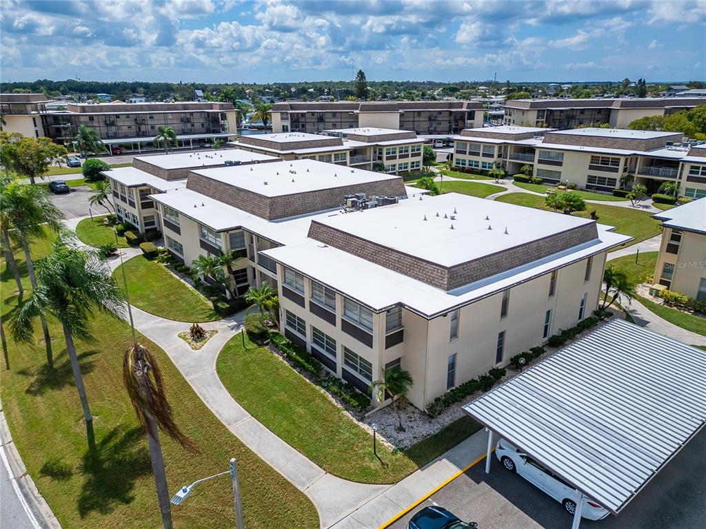 4600 Marine Parkway, Unit 104 New Port Richey, FL 34652 - Photo 47 of 69 an aerial view of a balcony with a table and chairs