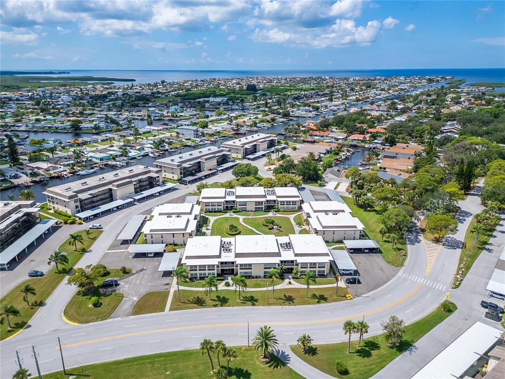 4600 Marine Parkway, Unit 104 New Port Richey, FL 34652 - Photo 53 of 69 an aerial view of a swimming pool with outdoor space