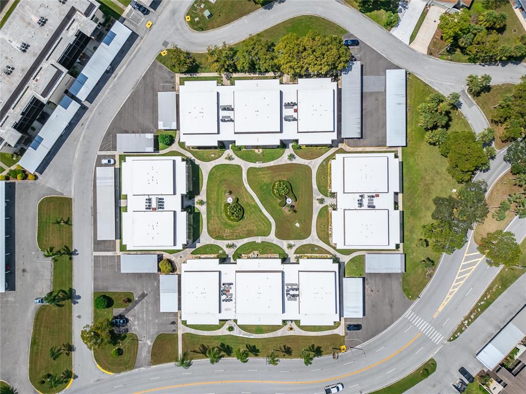 4600 Marine Parkway, Unit 104 New Port Richey, FL 34652 - Photo 56 of 69 an aerial view of residential houses with outdoor space