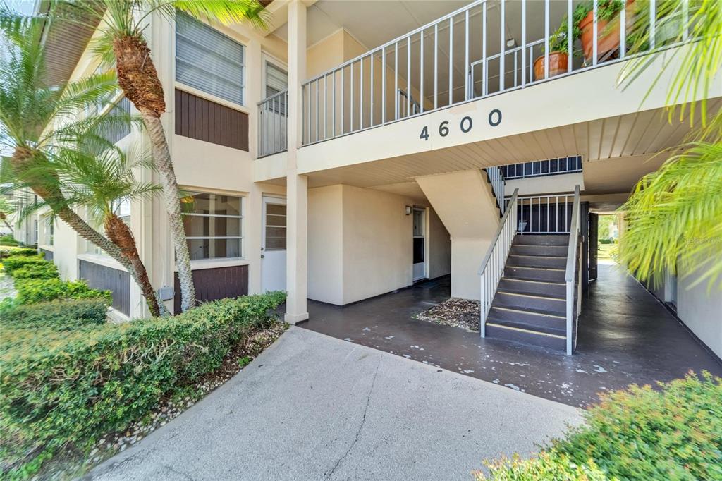 4600 Marine Parkway, Unit 104 New Port Richey, FL 34652 - Photo 6 of 69 a view of a building with entryway and stairs