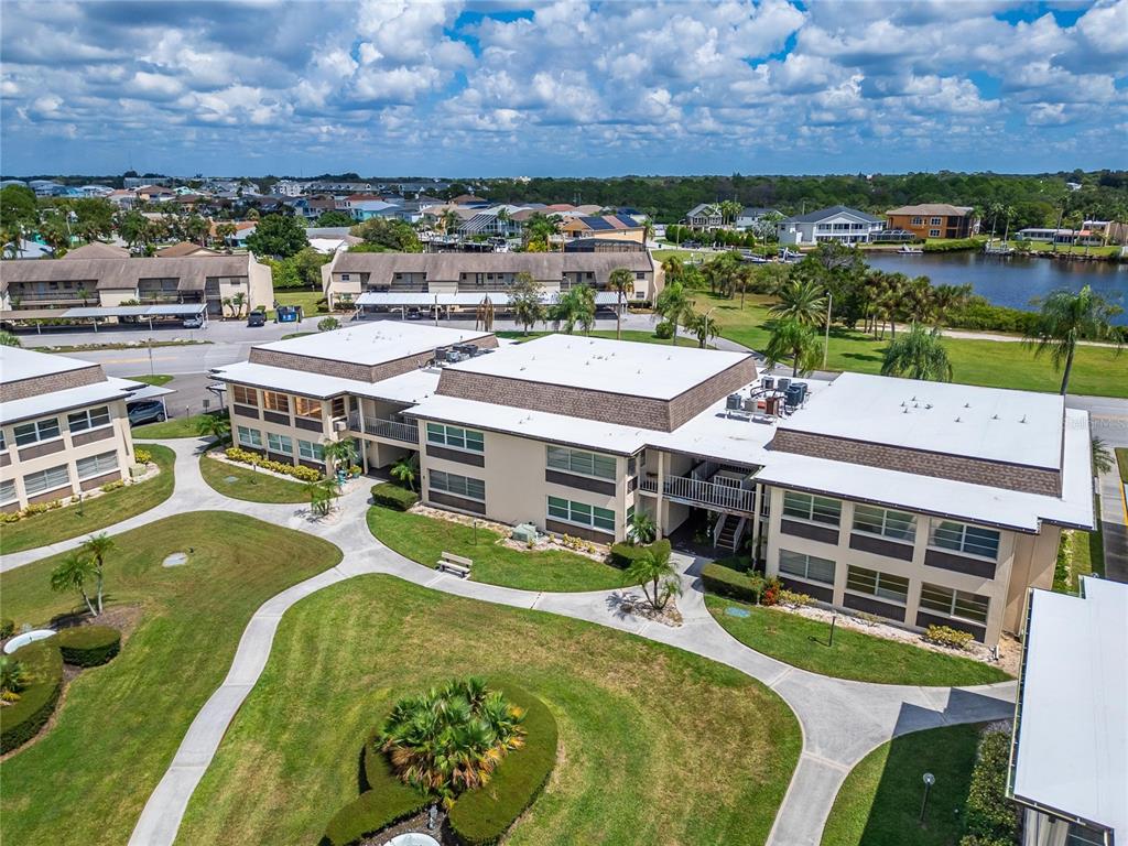 4600 Marine Parkway, Unit 104 New Port Richey, FL 34652 - Photo 63 of 69 a view of a swimming pool and outdoor seating