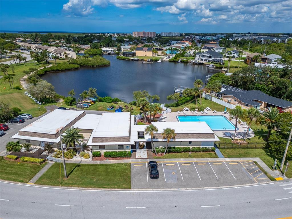 4600 Marine Parkway, Unit 104 New Port Richey, FL 34652 - Photo 65 of 69 an aerial view of a house with a swimming pool yard and outdoor seating