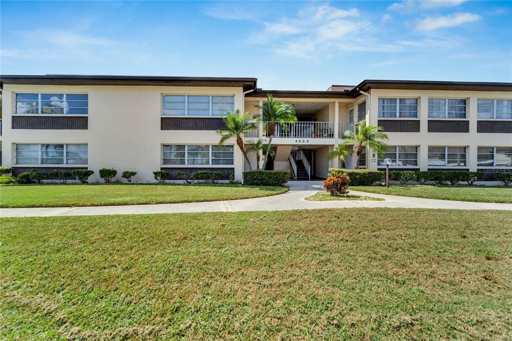 4600 Marine Parkway, Unit 104 New Port Richey, FL 34652 - Photo 7 of 69 a view of a house with a swimming pool