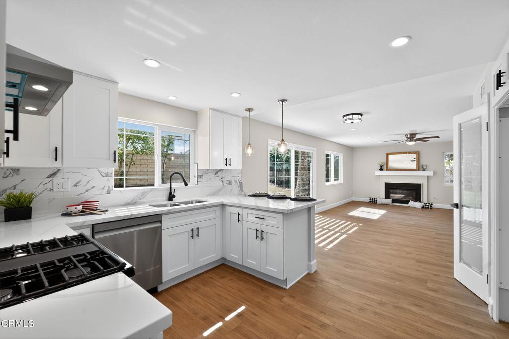 2848 Jadestone Avenue Simi Valley, CA 93063 - Photo 11 of 31 a kitchen with stainless steel appliances a sink stove and wooden floor