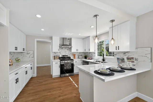 a view of a kitchen with a sink and a window