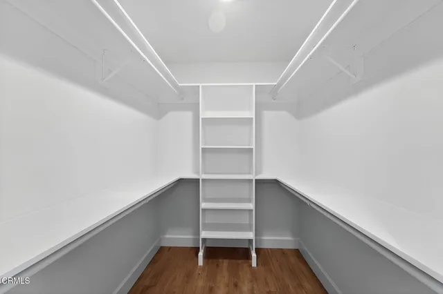 a bathroom with a sink a glass door and a mirror