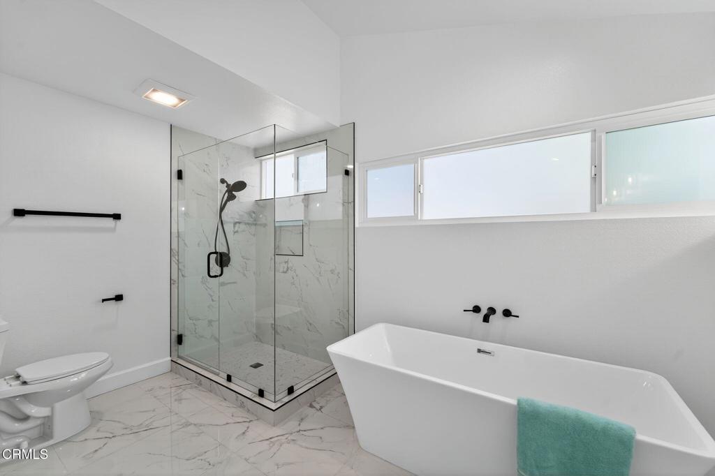 2848 Jadestone Avenue Simi Valley, CA 93063 - Photo 20 of 31 a spacious bathroom with a tub a toilet and shower