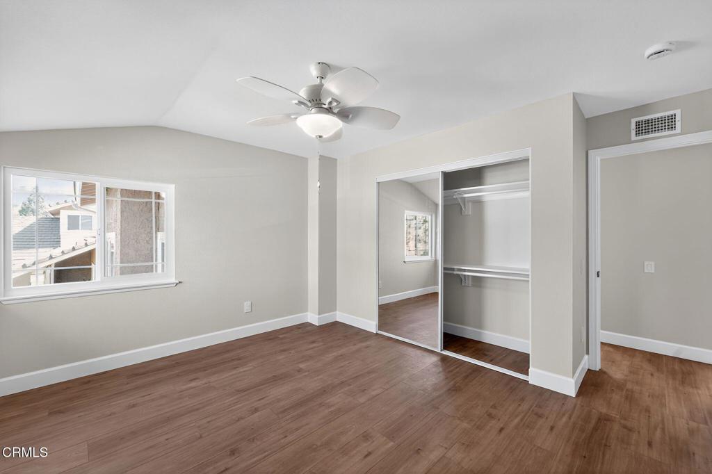 2848 Jadestone Avenue Simi Valley, CA 93063 - Photo 23 of 31 a view of an empty room with a window and wooden floor