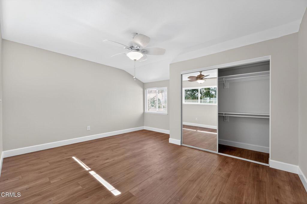 2848 Jadestone Avenue Simi Valley, CA 93063 - Photo 24 of 31 a view of an empty room with a window and wooden floor