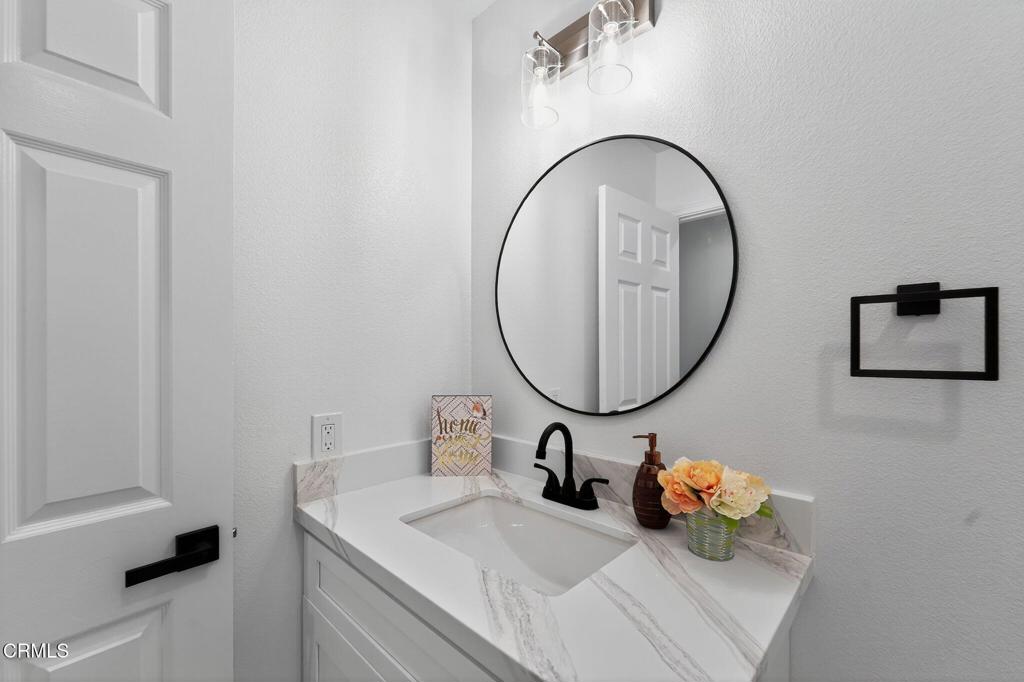 2848 Jadestone Avenue Simi Valley, CA 93063 - Photo 28 of 31 a bathroom with a sink and a mirror