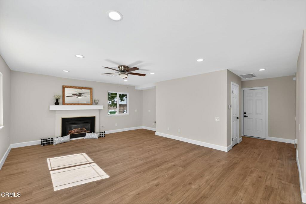 2848 Jadestone Avenue Simi Valley, CA 93063 - Photo 7 of 31 an empty room with windows and fireplace