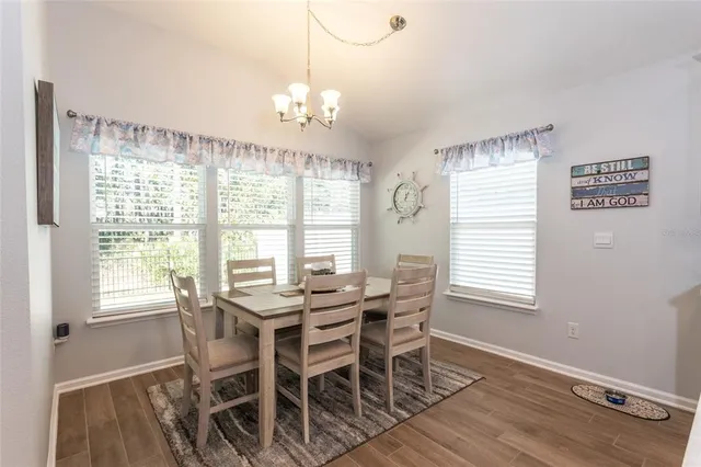 a bedroom with a large bed and a dresser
