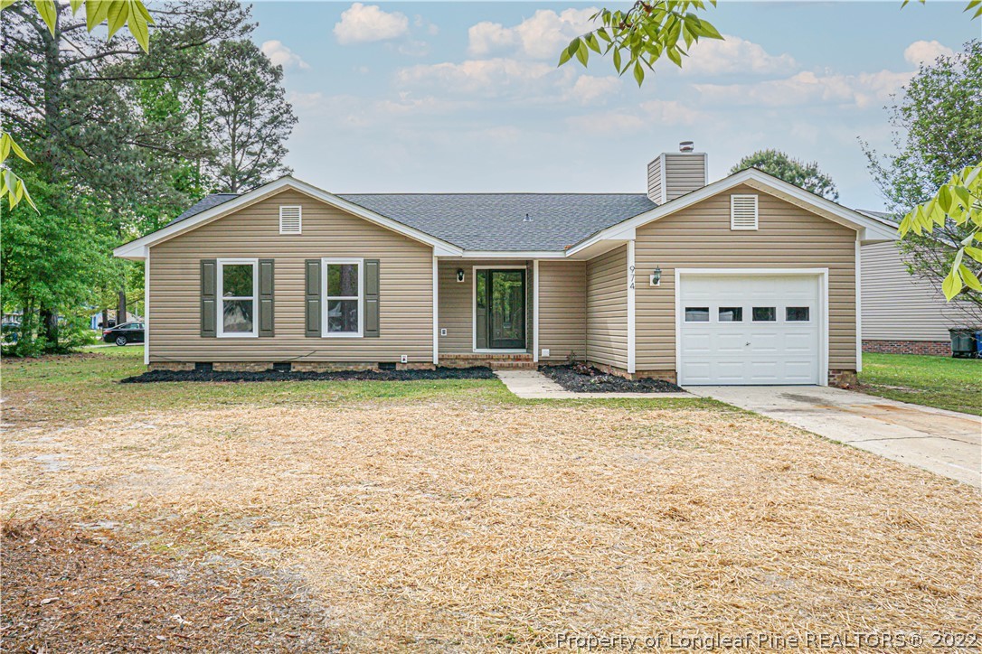 974 Rim Road Fayetteville, NC 28314 - Photo 1 of 40 a view of a house with a yard and large tree