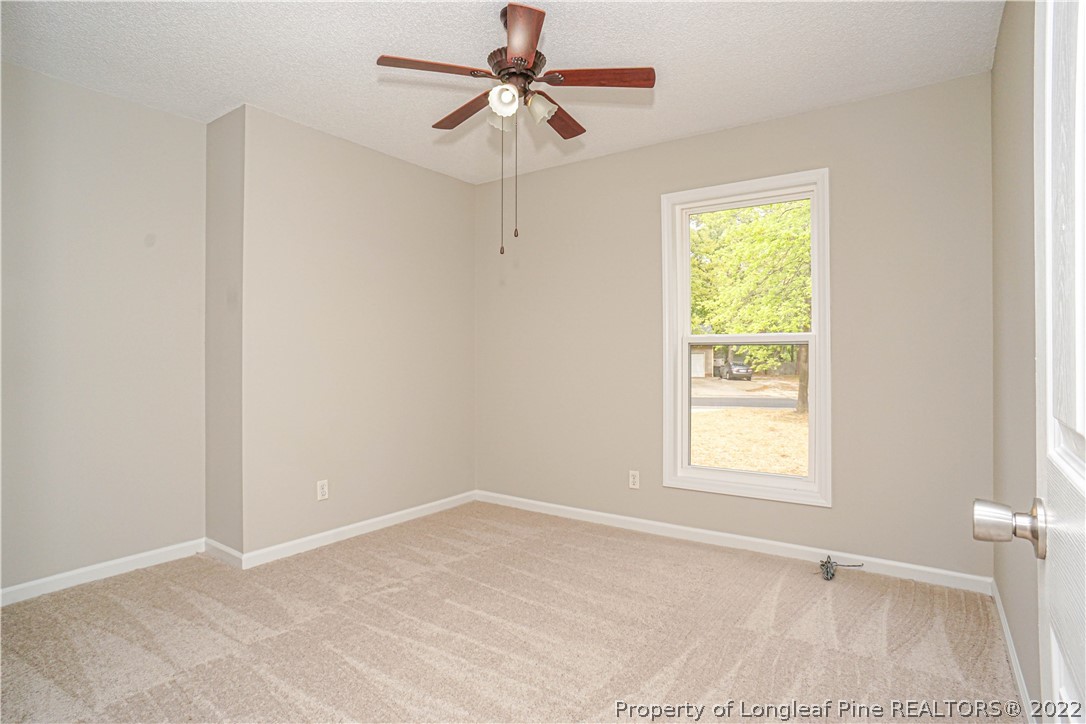 974 Rim Road Fayetteville, NC 28314 - Photo 19 of 40 an empty room with windows and fan