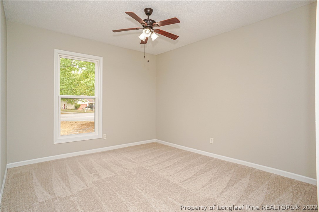 974 Rim Road Fayetteville, NC 28314 - Photo 20 of 40 an empty room with a window and a fan