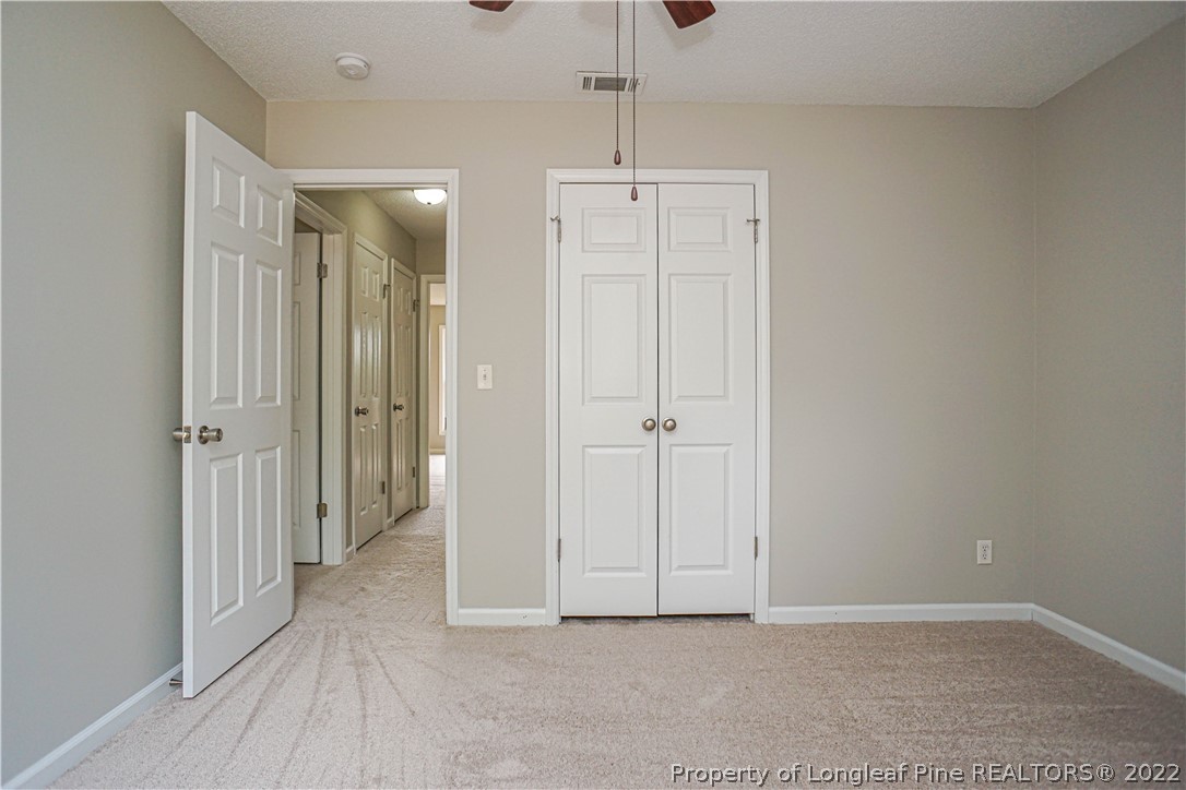974 Rim Road Fayetteville, NC 28314 - Photo 21 of 40 a view of a hallway with closet area