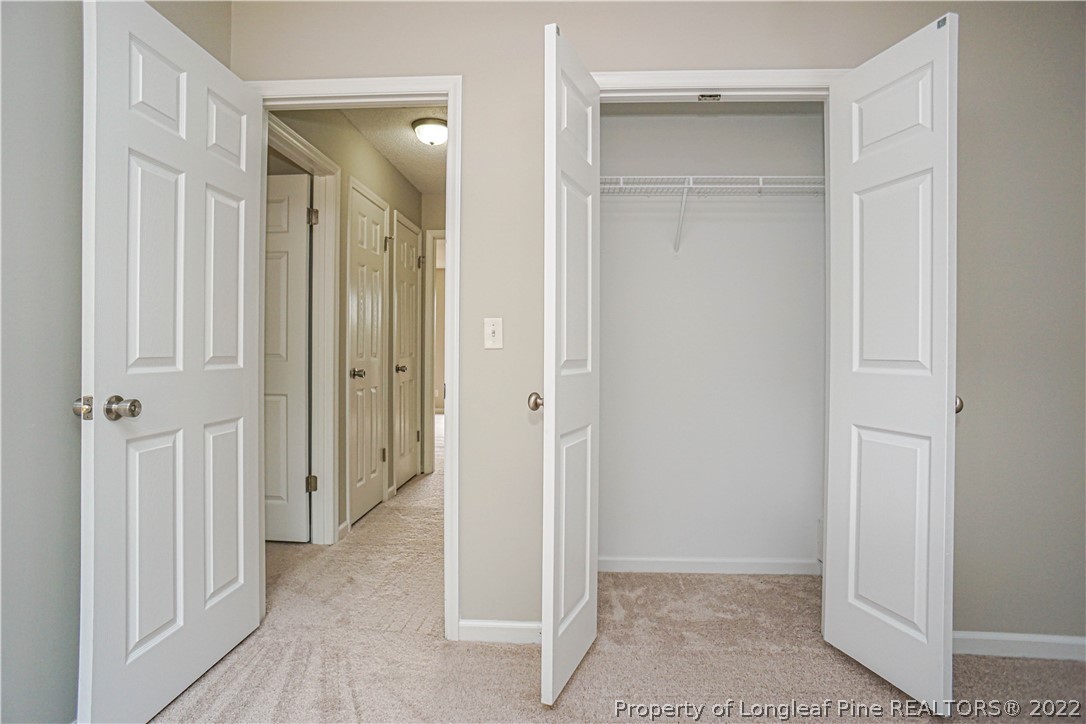974 Rim Road Fayetteville, NC 28314 - Photo 23 of 40 a view of a hallway with wooden floor