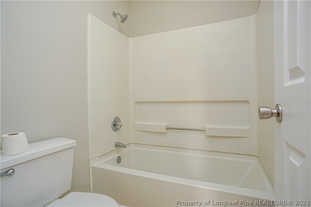 974 Rim Road Fayetteville, NC 28314 - Photo 33 of 40 a bathroom with a bathtub and toilet