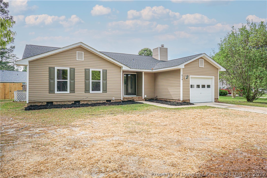 974 Rim Road Fayetteville, NC 28314 - Photo 39 of 40 a front view of a house with a yard