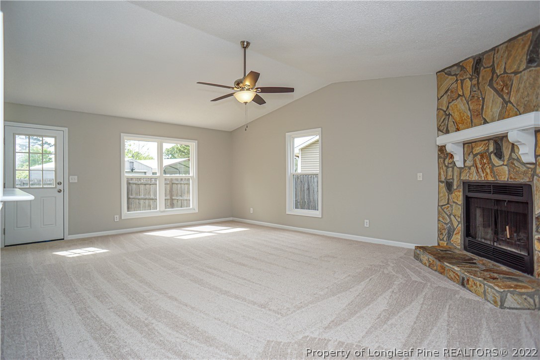 974 Rim Road Fayetteville, NC 28314 - Photo 5 of 40 a view of an empty room with a window and fireplace