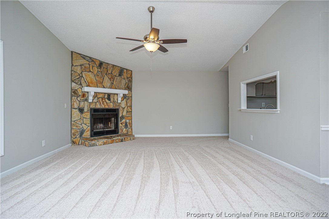 974 Rim Road Fayetteville, NC 28314 - Photo 6 of 40 a view of an empty room with window and fireplace
