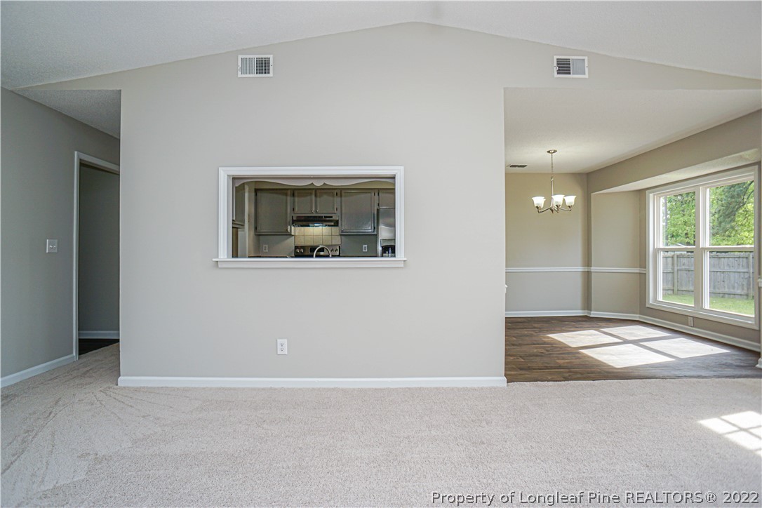 974 Rim Road Fayetteville, NC 28314 - Photo 9 of 40 an empty room with windows and entrance