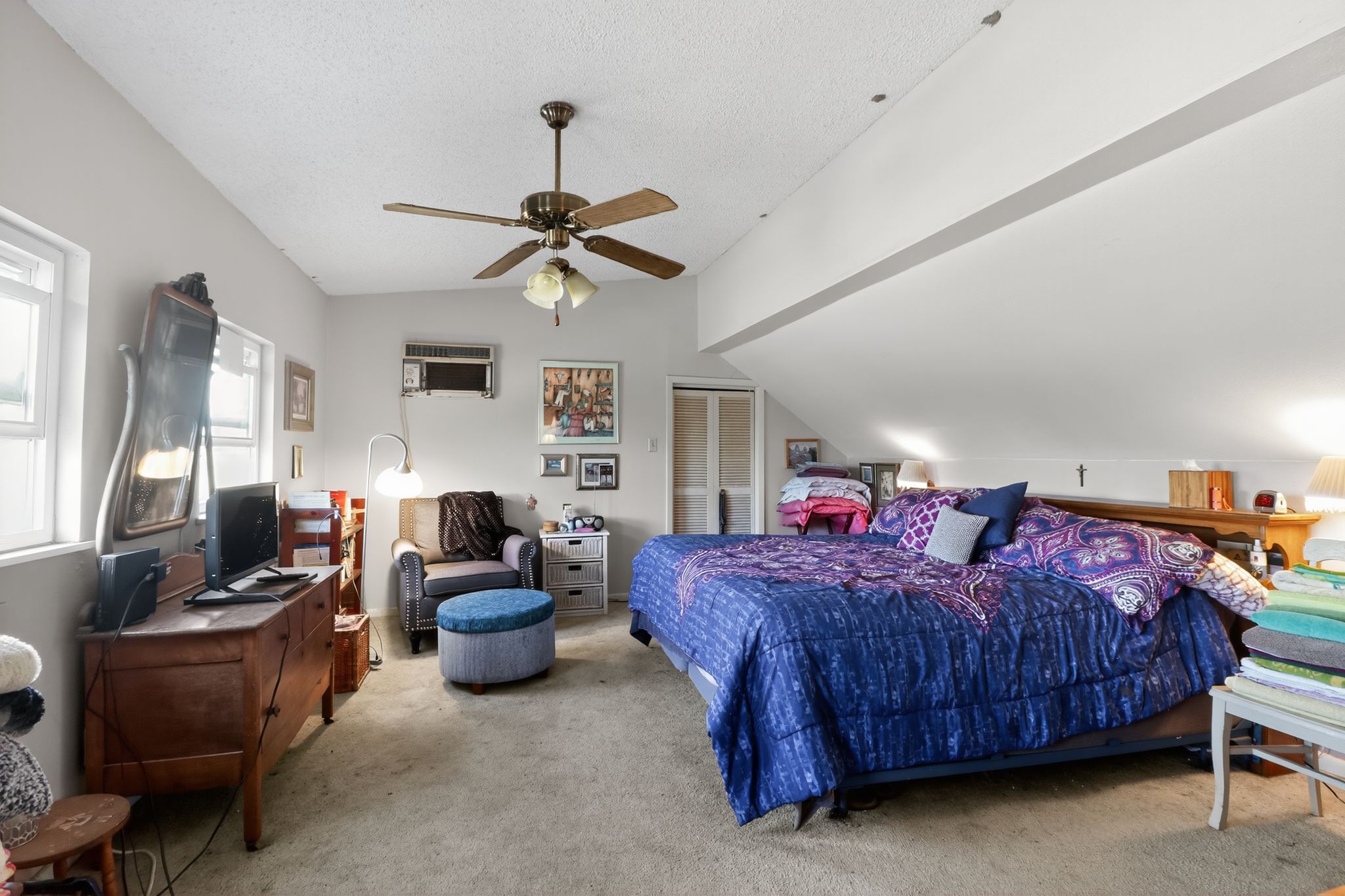 950 Ater Ranch Estates Bertram, TX 78605 - Photo 12 of 40 a bedroom with a bed and a chandelier