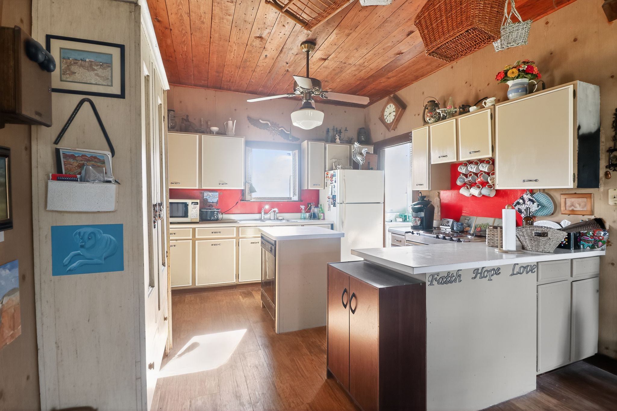 950 Ater Ranch Estates Bertram, TX 78605 - Photo 7 of 40 a kitchen that has a lot of cabinets and refrigerator in it