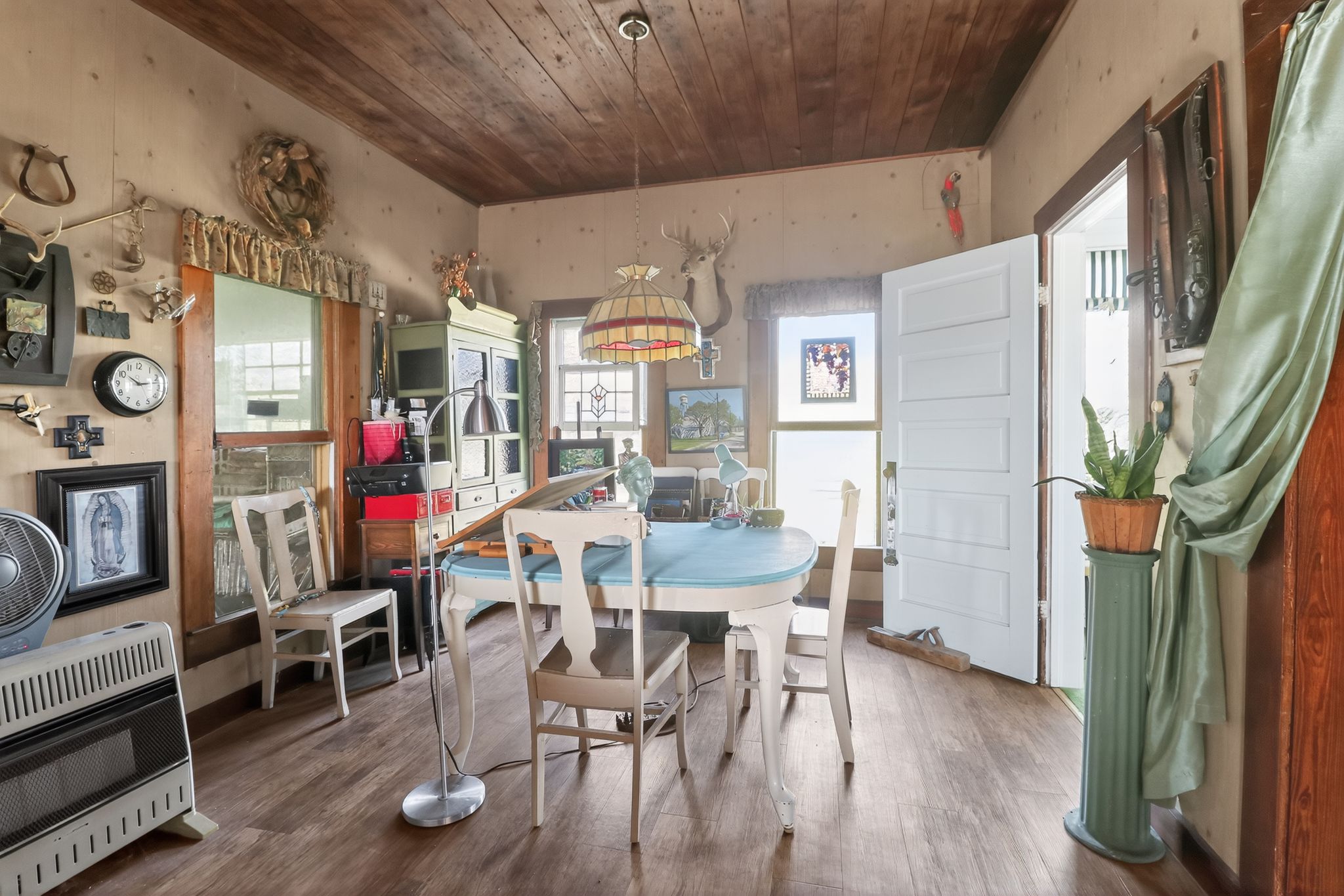 950 Ater Ranch Estates Bertram, TX 78605 - Photo 8 of 40 a view of a dining room with furniture window and wooden floor