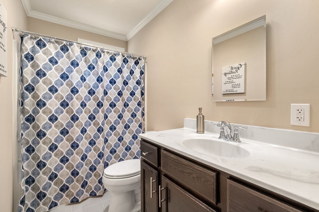1 Elm Street, Unit 4 Boston, MA 02122 - Photo 11 of 15 a bathroom with a sink and a toilet