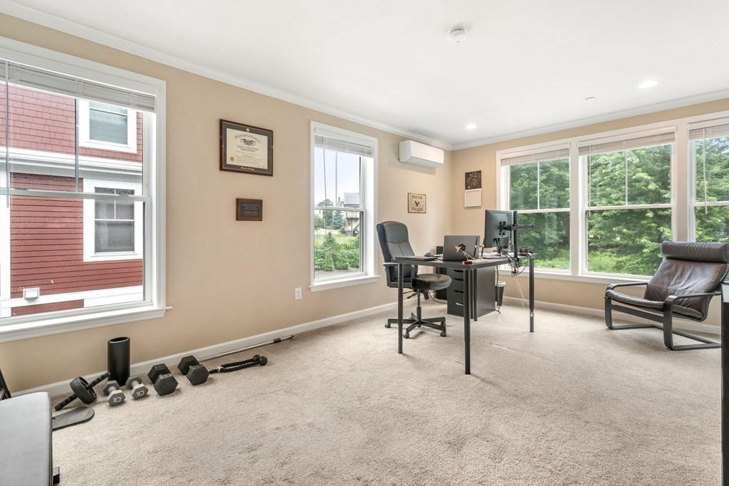 1 Elm Street, Unit 4 Boston, MA 02122 - Photo 12 of 15 a view of a livingroom with workspace and a window