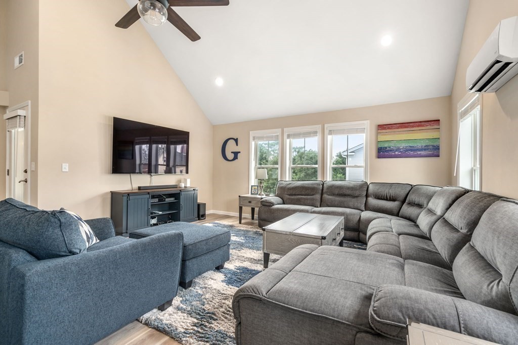 1 Elm Street, Unit 4 Boston, MA 02122 - Photo 2 of 15 a living room with furniture and a large window