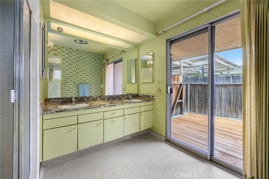 3116 Firethorne Avenue Fullerton, CA 92835 - Photo 17 of 32 a bathroom with a tub sink and mirror