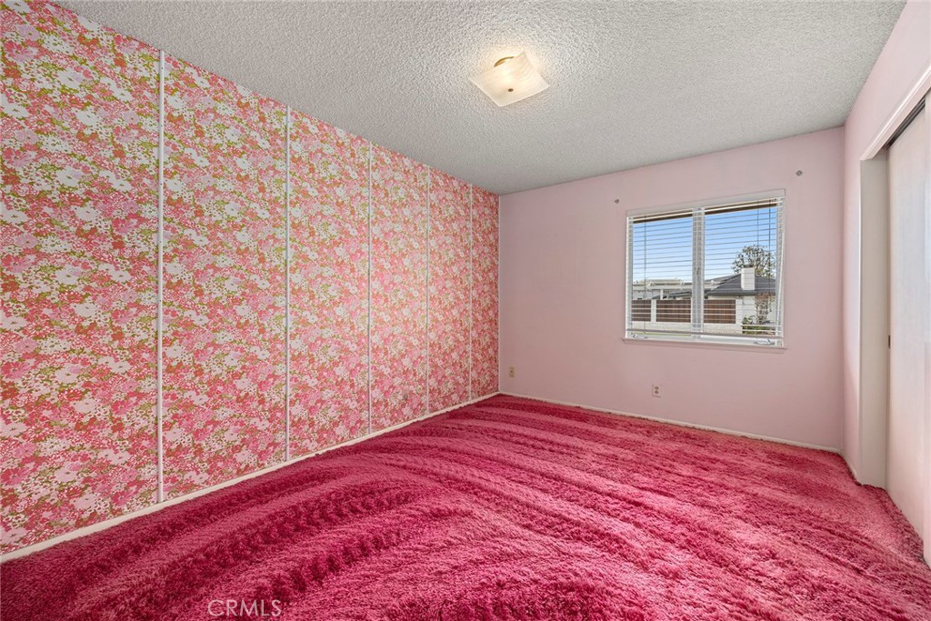 3116 Firethorne Avenue Fullerton, CA 92835 - Photo 19 of 32 a view of empty room with wooden floor and fan