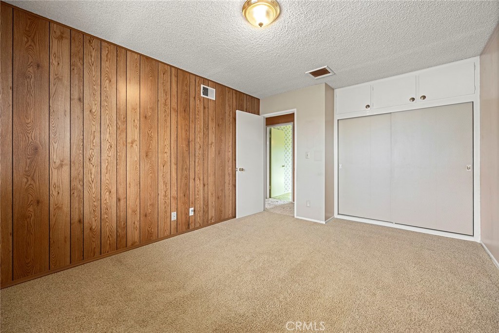 3116 Firethorne Avenue Fullerton, CA 92835 - Photo 20 of 32 a view of an empty room with wooden walls